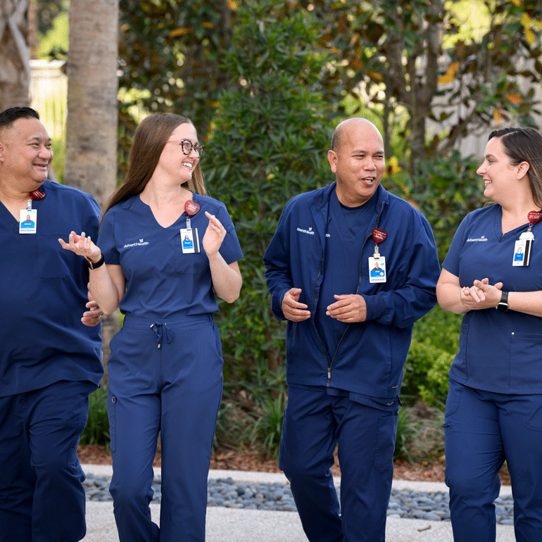 A diverse group of international nurses walking together outside