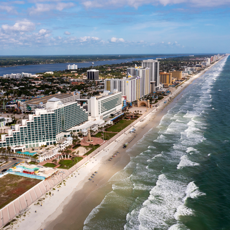 Florida coastline with a beautiful beach and a city skyline