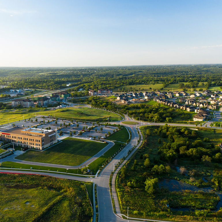 Lush trees and vegetation surrounding a small Kansas town
