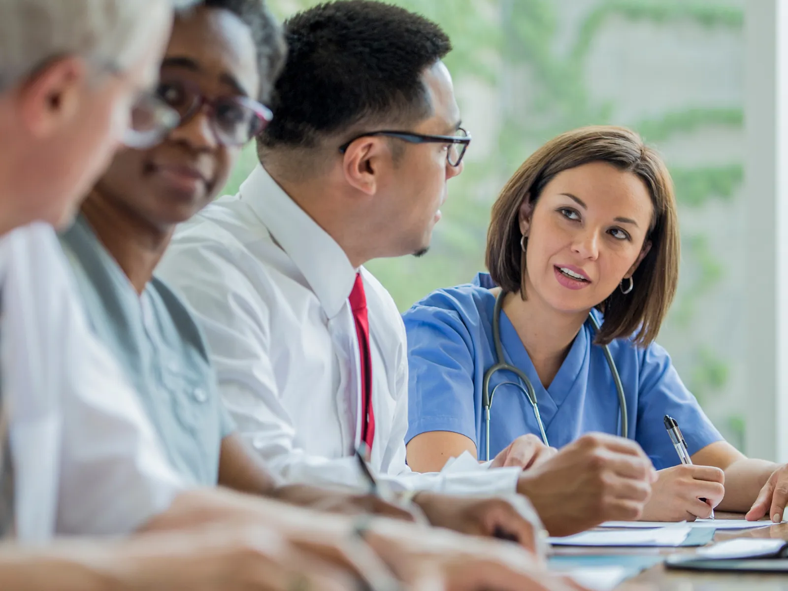 A Resident speaks with Hospital Staff