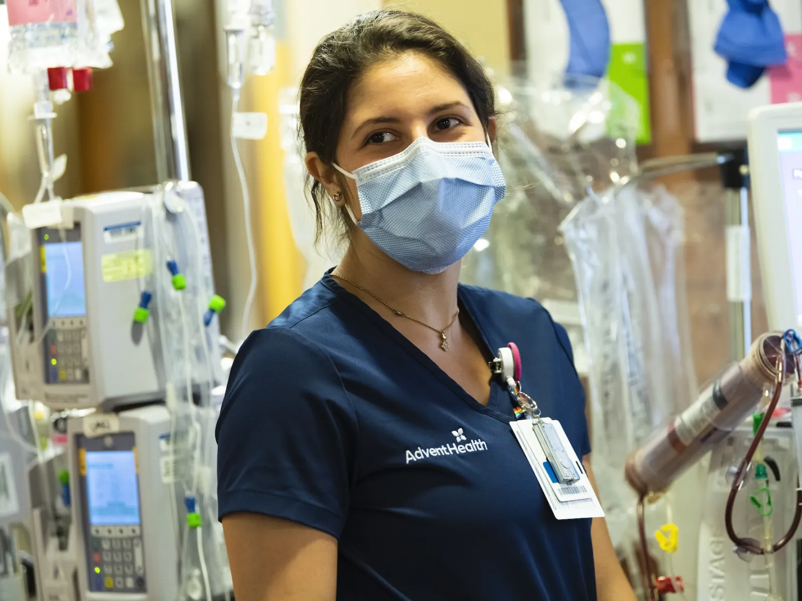 A nurse wearing a face mask at a facility.