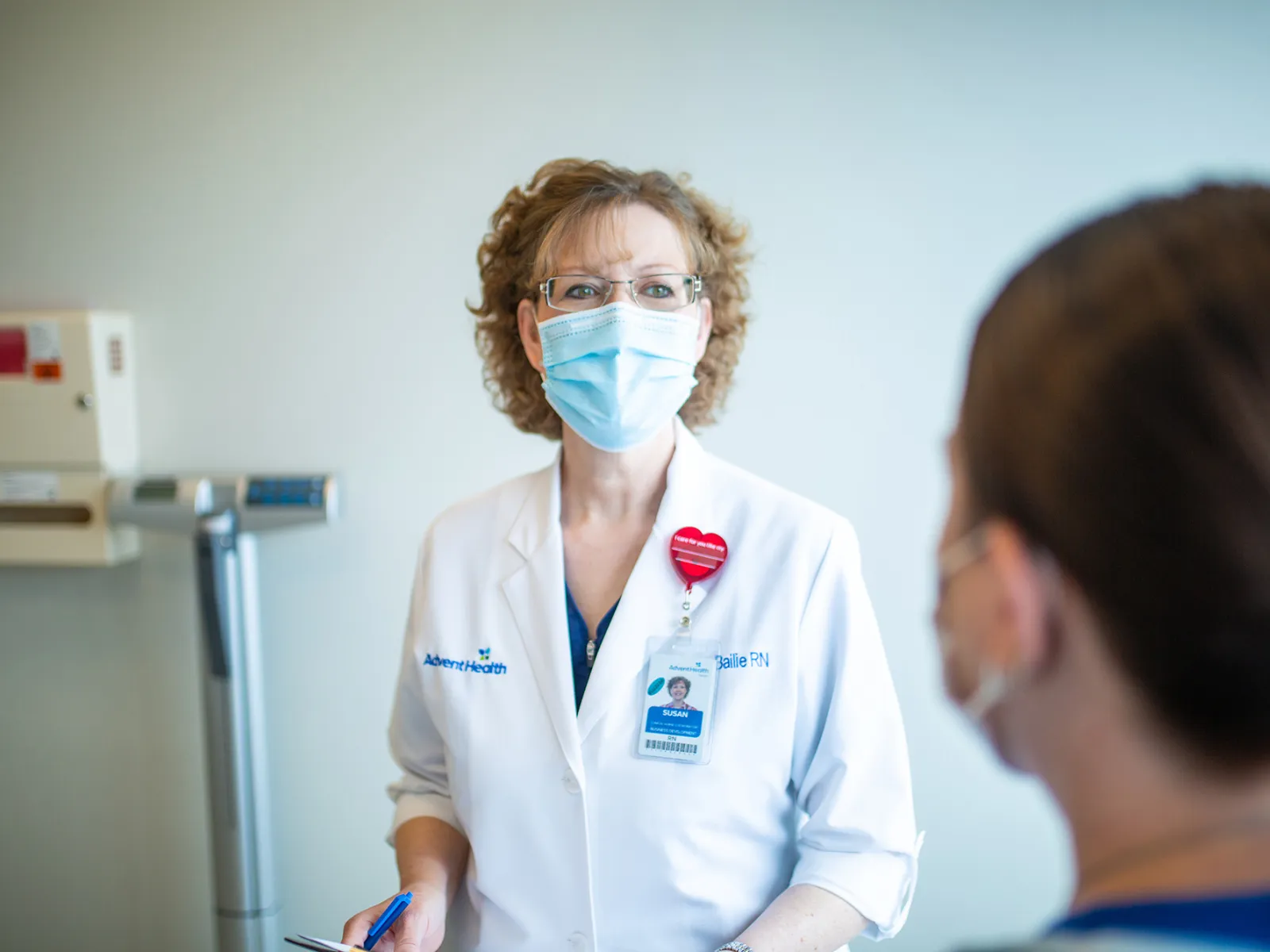 Physician talking with a patient.
