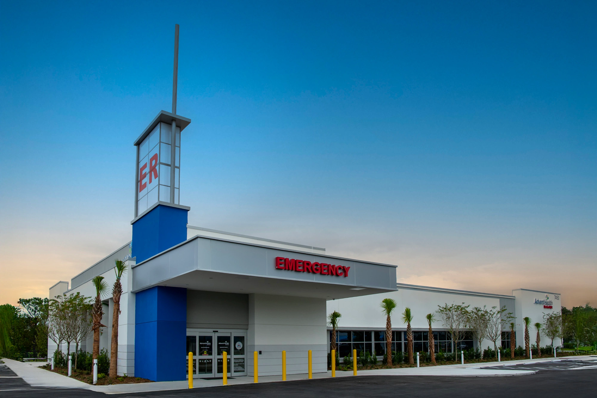 Exterior of AdventHealth Sanford ER with emergency entrance and tower signage.